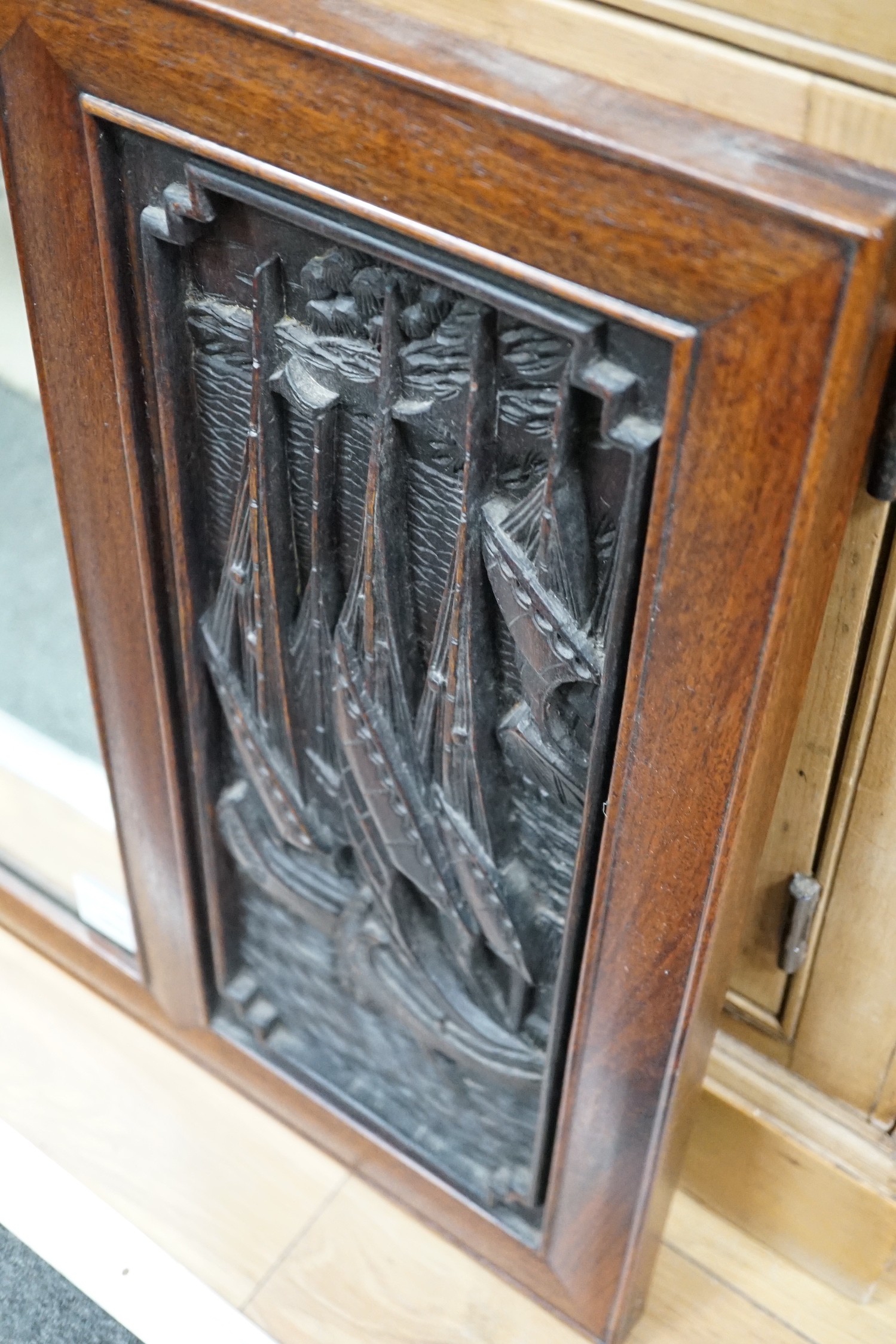 A Chinese hardwood relief carved wall mirror, width 114cm, height 53cm *Please note the sale commences at 9am.